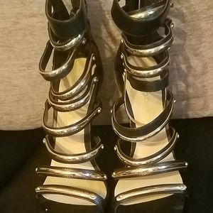 GOLD AND BLACK HEEL SANDALS